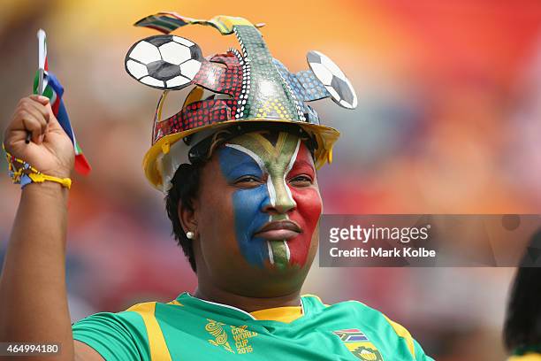 South African supporter in the crowd watches on during the 2015 ICC Cricket World Cup match between South Africa and Ireland at Manuka Oval on March...