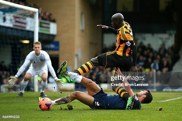 Yannick Sagbo of Hull City is tackled by Mark Phillips of Southend during the FA Cup fourth round match between Southend United and Hull City at...