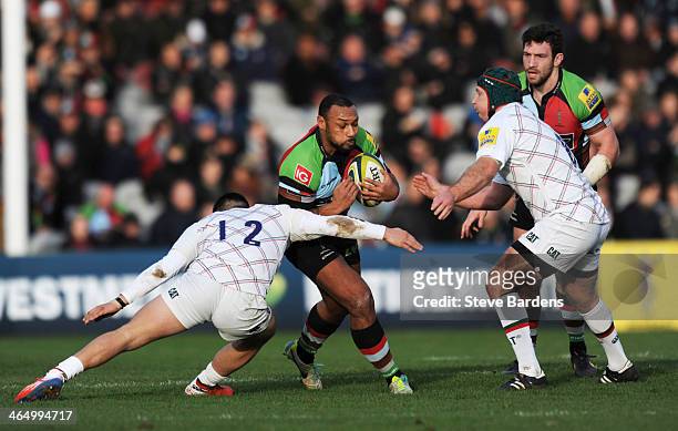 Jordan Turner-Hall of Harlequins is tackled by Terrence Hepetema of Leicester Tigers during the LV= Cup match between Harlequins and Leicester Tigers...