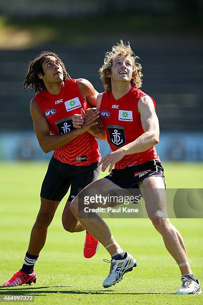 Tendai Mzungu and David Mundy of the Dockers contest for position during a Fremantle Dockers AFL training session at Fremantle Oval on March 3, 2015...