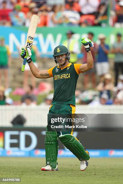 Faf du Plessis of South Africa celebrates his century during the 2015 ICC Cricket World Cup match between South Africa and Ireland at Manuka Oval on...