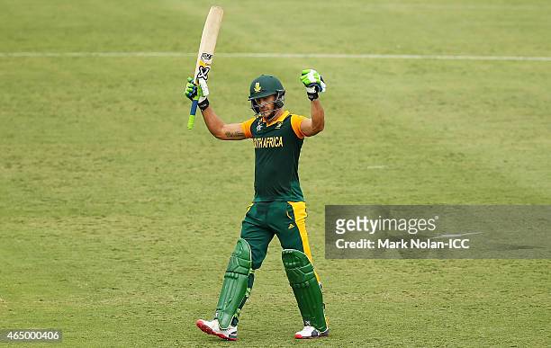 Francois Du Plessis celebrates scoring a century during the 2015 ICC Cricket World Cup match between South Africa and Ireland at Manuka Oval on March...