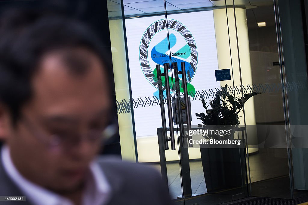 Standard Chartered Plc Branches Ahead Of Earnings