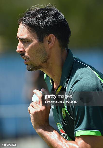 Australia's Mitchell Johnson runs in to bowl during a final training session ahead of the 2015 Cricket World Cup Pool A match between Australia and...