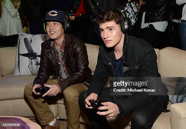 Actors Gregg Sulkin and Allen Evangelista attend the Nerdist + Xbox Live App Launch Party at Microsoft Lounge on March 2, 2015 in Venice, California.
