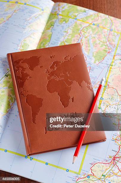 travel journal on map - trip diary stock pictures, royalty-free photos & images