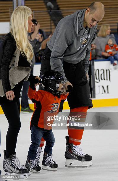 Ryan Getzlaf of the Anaheim Ducks skates with his family during the family skate following team practice for the 2014 Coors Light NHL Stadium Series...