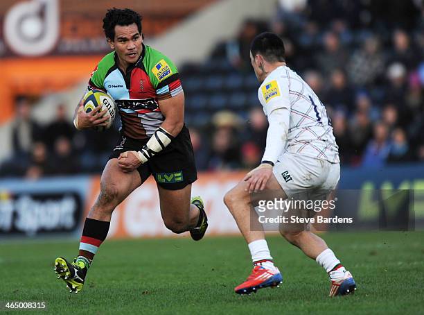 Maurie Fa'asavalu of Harlequins takes on Terrence Hepetema of Leicester Tigers defence during the LV= Cup match between Harlequins and Leicester...