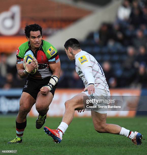 Maurie Fa'asavalu of Harlequins takes on Terrence Hepetema of Leicester Tigers defence during the LV= Cup match between Harlequins and Leicester...