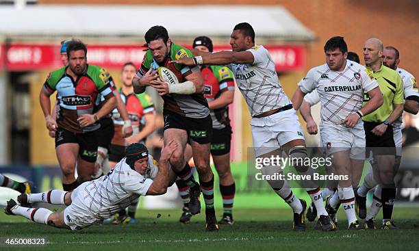 Tom Guest of Harlequins is tackled by Thomas Waldrom of Leicester Tigers during the LV= Cup match between Harlequins and Leicester Tigers at...