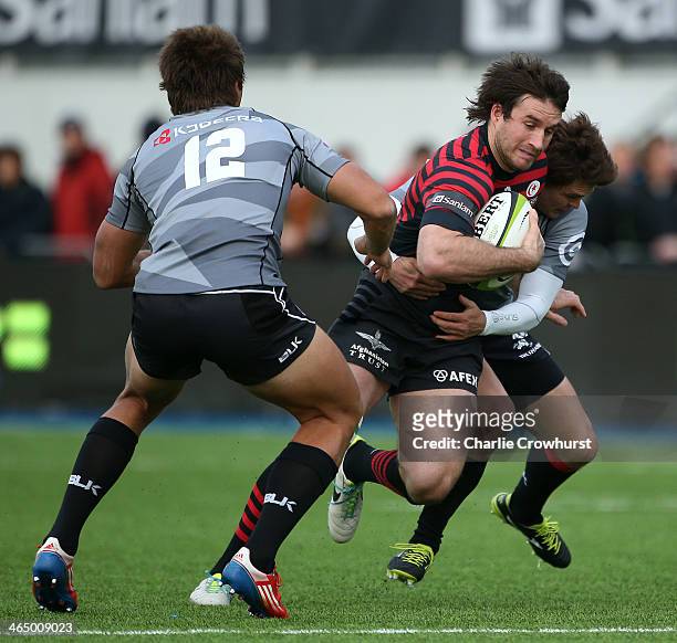 Marcelo Bosch of Saracens is tackled during the friendly match between Saracens and Natal Cell C Sharks at Allianz Park on January 25, 2014 in...