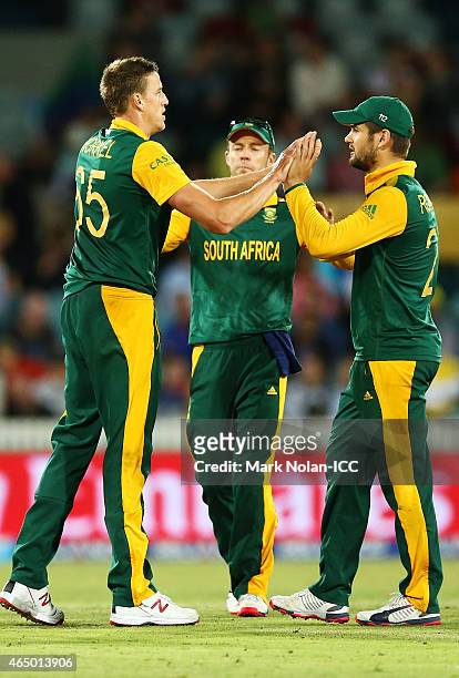 Morne Morkel of South Africa celebrates a wicket with team mates during the 2015 ICC Cricket World Cup match between South Africa and Ireland at...