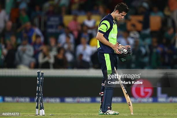 George Dockrell of Ireland looks dejected after being bowled by Morne Morkel of South Africa during the 2015 ICC Cricket World Cup match between...