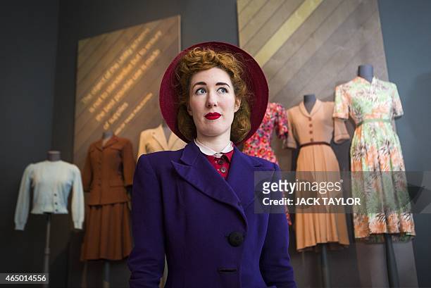 Model Sadie Doherty wears 1940s style clothing as she poses for the photographer during a photo call for the exhibition 'Fashion on the Ration -...
