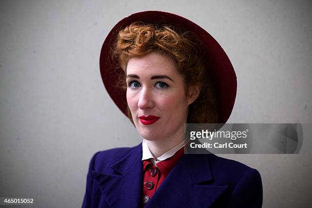 Model poses in a 1940s era outfit during a photocall to highlight the forthcoming Fashion on the Ration: 1940s Street Style exhibition at the...