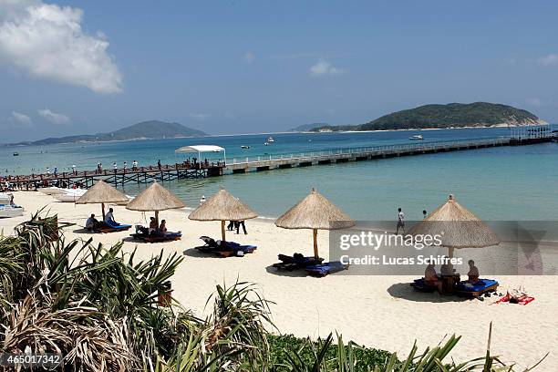 May 01: Tourists lay on the beach at Yalong bay on May 1, 2008 in Sanya, Hainan province, China. Sanya is the southernmost city of Hainan island,...