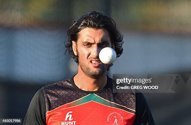 Afghanistan's Shapoor Zadran prepares to bowl during a final training session ahead of the 2015 Cricket World Cup Pool A match between Australia and...