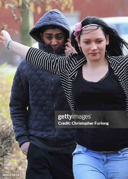 Shayfur Rahman, aged 31, and an unidentfied woman, arrives at Bury Magistrates Court where Rahman is facing charges of alleged child exploitation on...