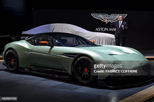 Aston Martin CEO Andy Palmer unveils the new Aston Martin Vulcan model on March 3, 2015 at the stand of the British carmaker during the press day of...