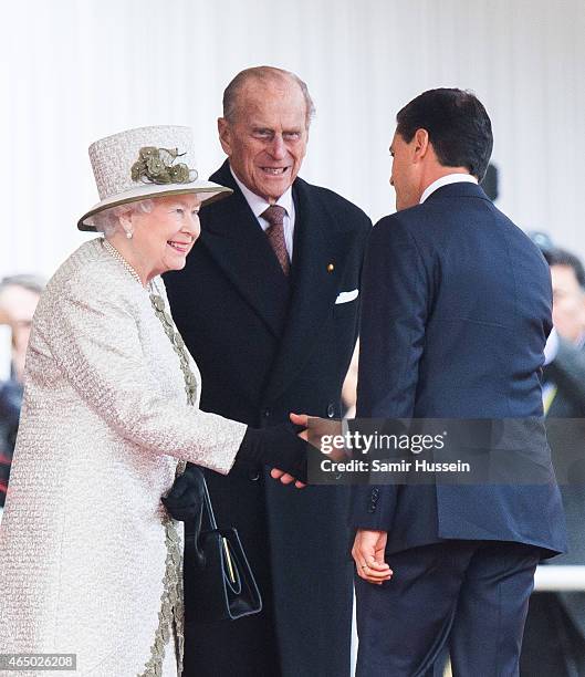 Queen Elizabeth II and Prince Philip, Duke of Edinburgh greet Mexican President Enrique Pena Nieto during a ceremonial welcome for The President Of...