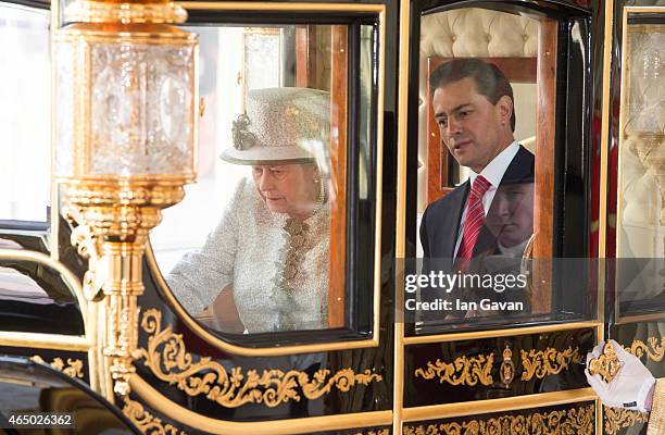 Queen Elizabeth II accompanies the President of the United Mexican States, Senor Enrique Pena Nieto to Buckingham Palace on March 3, 2015 in London,...