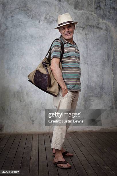 portrait of man smiling with hand made bag - cropped trousers stock pictures, royalty-free photos & images