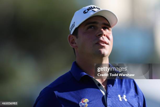 Gary Woodland looks on from the 18th green during the third round of the Farmers Insurance Open on Torrey Pines South on January 25, 2014 in La...