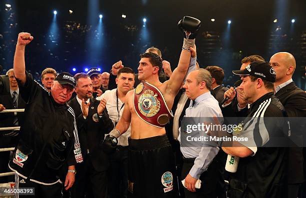 Marco Huck of Germany celebrate with coach Ulli Wegner after winning the WBO Cruiserweight title fight over Firat Arslan of Germany at...