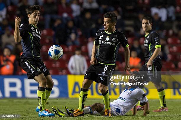 Christian Bermudez of Queretaro fights for the ball with Juan Pablo Rodriguez of Santos during a match between Queretaro and Pumas UNAM as part of...