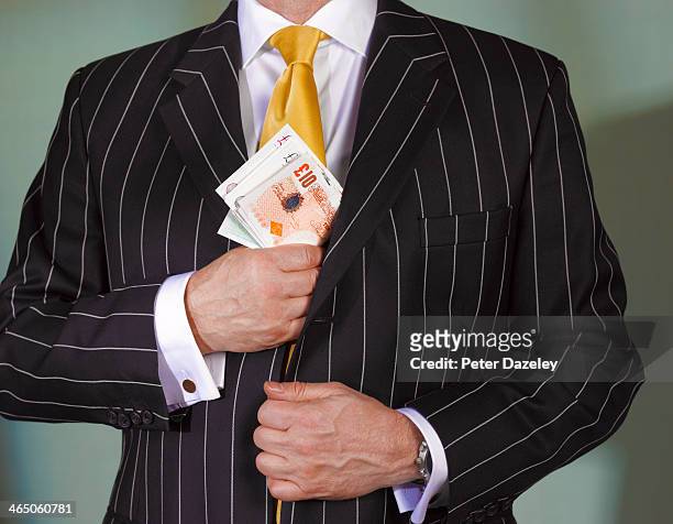 financial advisor with british currency - bank fraud stockfoto's en -beelden