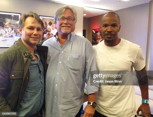 DuJour Media Founder Jason Binn, Owner of the NBA Miami Heat Micky Arison and Jamie Foxx at the Miami Heat NBA game on January 2, 2014 in Miami.