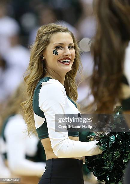 Members of the Michigan State Spartans Dance Team perform during the game against the University of Michigan at Breslin Center on January 25, 2014 in...