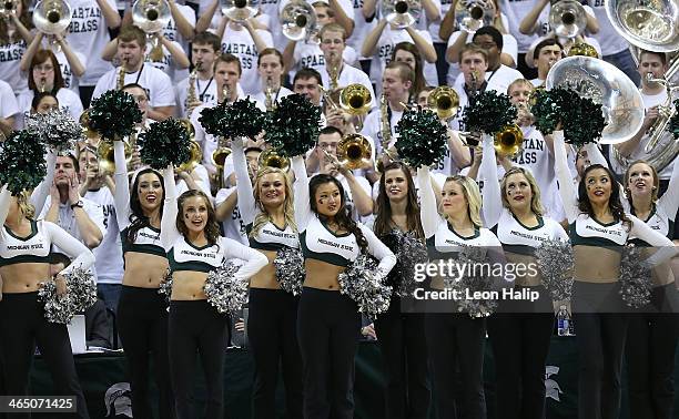 Members of the Michigan State Spartans Dance Team perform during the game against the University of Michigan at Breslin Center on January 25, 2014 in...