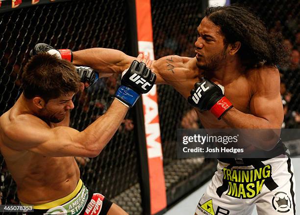 Benson Henderson punches Josh Thomson during their lightweight fight at the FOX UFC Saturday event at the United Center on January 25, 2014 in...