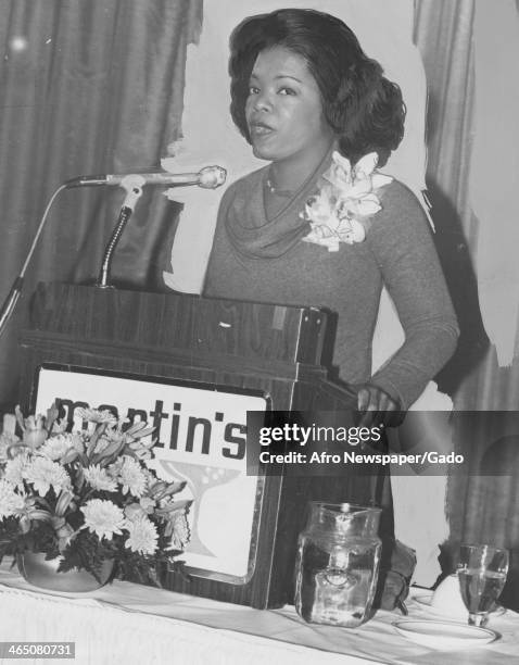 Oprah Winfrey speaks at a podium early in her career, during her time at WJZ, Baltimore, Maryland, January 20, 1978.