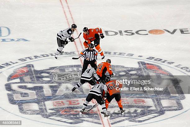 Colin Fraser of the Los Angeles Kings faces off against Daniel Winnik of the Anaheim Ducks during the first period of the 2014 Coors Light NHL...