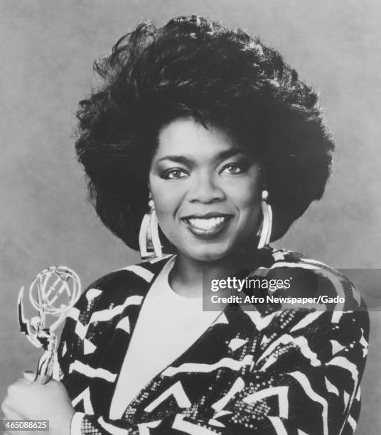 Talk show host Oprah Winfrey holds her Daytime Emmy for Outstanding Talk or Service Show Host, awarded for the Oprah Winfrey Show, 1987.