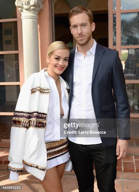 Singer/songwriter Rita Ora and DJ/Producer Calvin Harris attend the Roc Nation Pre-GRAMMY Brunch Presented by MAC Viva Glam at Private Residence on...