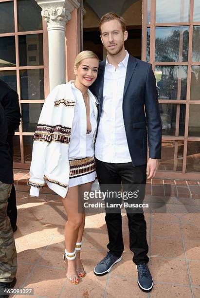 Singer/songwriter Rita Ora and DJ/Producer Calvin Harris attend the Roc Nation Pre-GRAMMY Brunch Presented by MAC Viva Glam at Private Residence on...