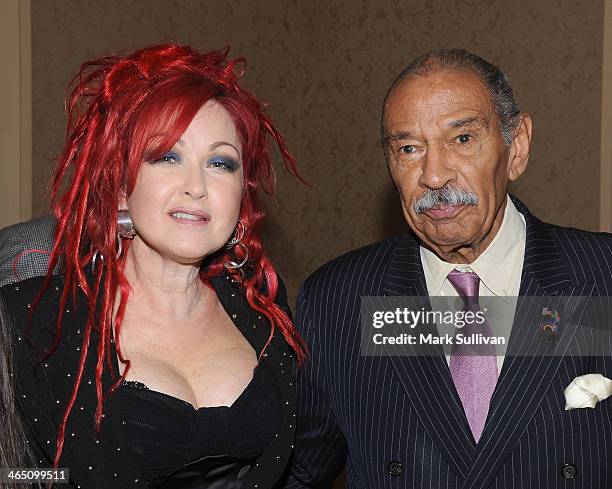 Singer Cyndi Lauper and U.S. Representative John Conyers attend the 56th GRAMMY Awards - Congressional Briefing at the Beverly Hilton Hotel on...