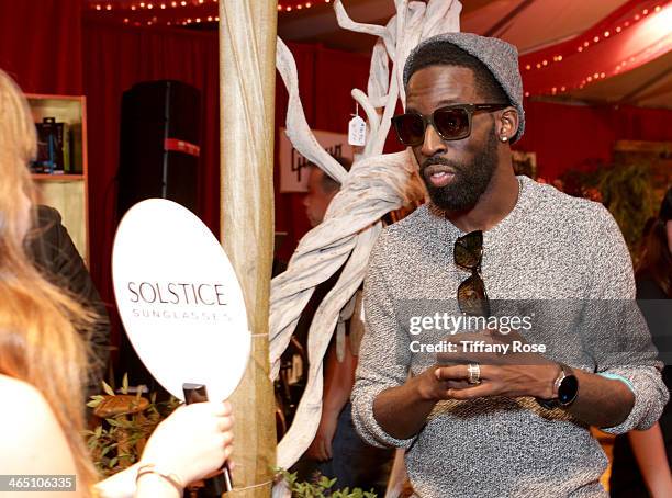 Singer Tye Tribbett wearing Marc by Marc Jacobs sunglasses with the Solstice Sunglasses and Safilo USA display at the GRAMMY Gift Lounge during the...