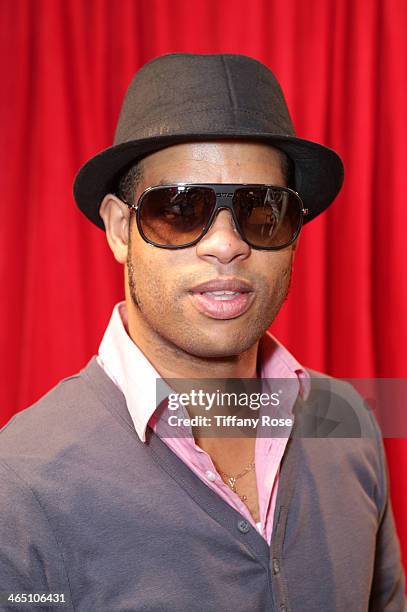 Musician Roberto Fonseca wearing Carrera sunglasses with the Solstice Sunglasses and Safilo USA display at the GRAMMY Gift Lounge during the 56th...