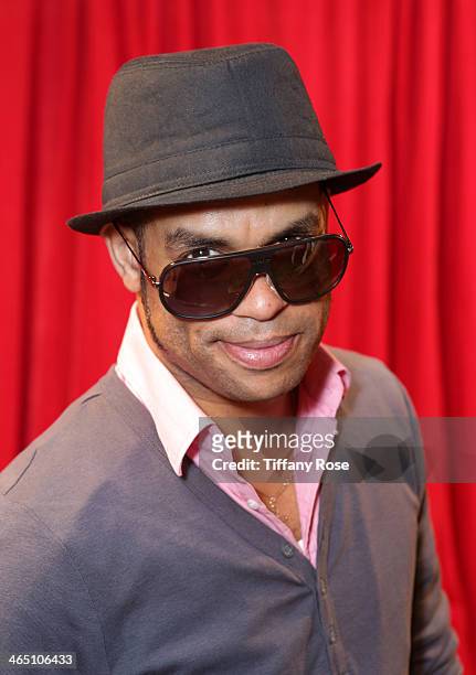 Musician Roberto Fonseca wearing Carrera sunglasses with the Solstice Sunglasses and Safilo USA display at the GRAMMY Gift Lounge during the 56th...