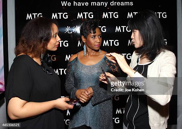 Musician Rhonda Nicole and producer Erica Taylor attend the GRAMMY Gift Lounge during the 56th Grammy Awards at Staples Center on January 25, 2014 in...