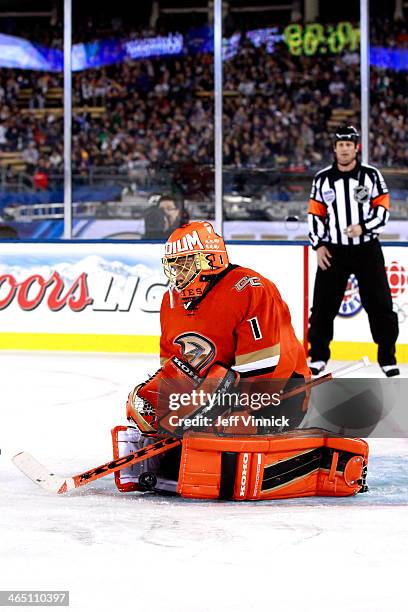 Jonas Hiller of the Anaheim Ducks makes a stop in the third period against the Los Angeles Kings in the 2014 Coors Light NHL Stadium Series at Dodger...