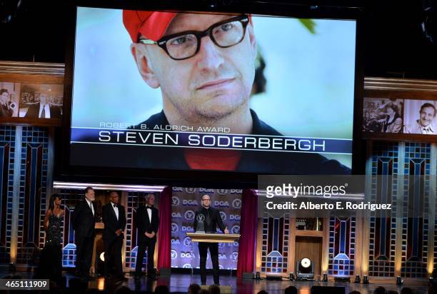 Director Taylor Hackford, DGA President Paris Barclay, director Michael Apted stand onstage as director Steven Soderbergh accepts the Robert B....