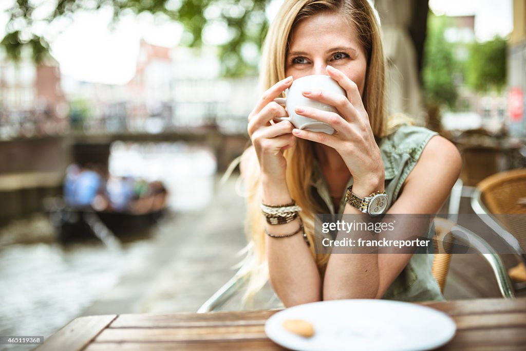 Smiling woman holding a coffee cup