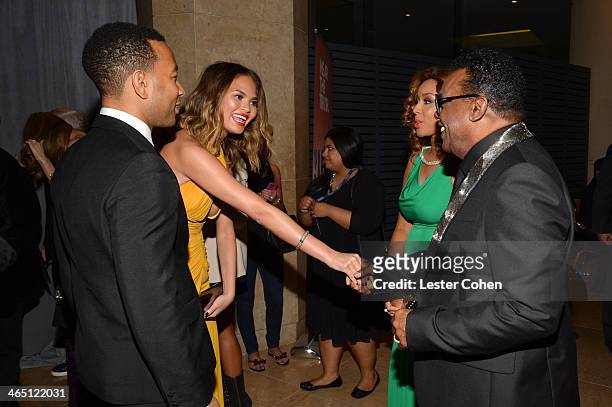 Singer John Legend, model Christine Teigen, Kandy Johnson Isley, and musician Ron Isley attend the 56th annual GRAMMY Awards Pre-GRAMMY Gala and...