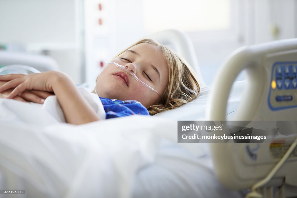 Young Girl Sleeping In Intensive Care Unit