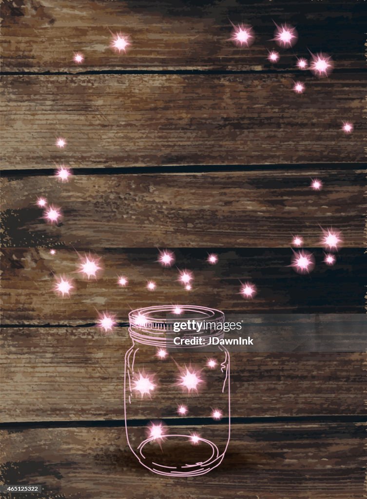Wooden background with canning jar and pink sparkles
